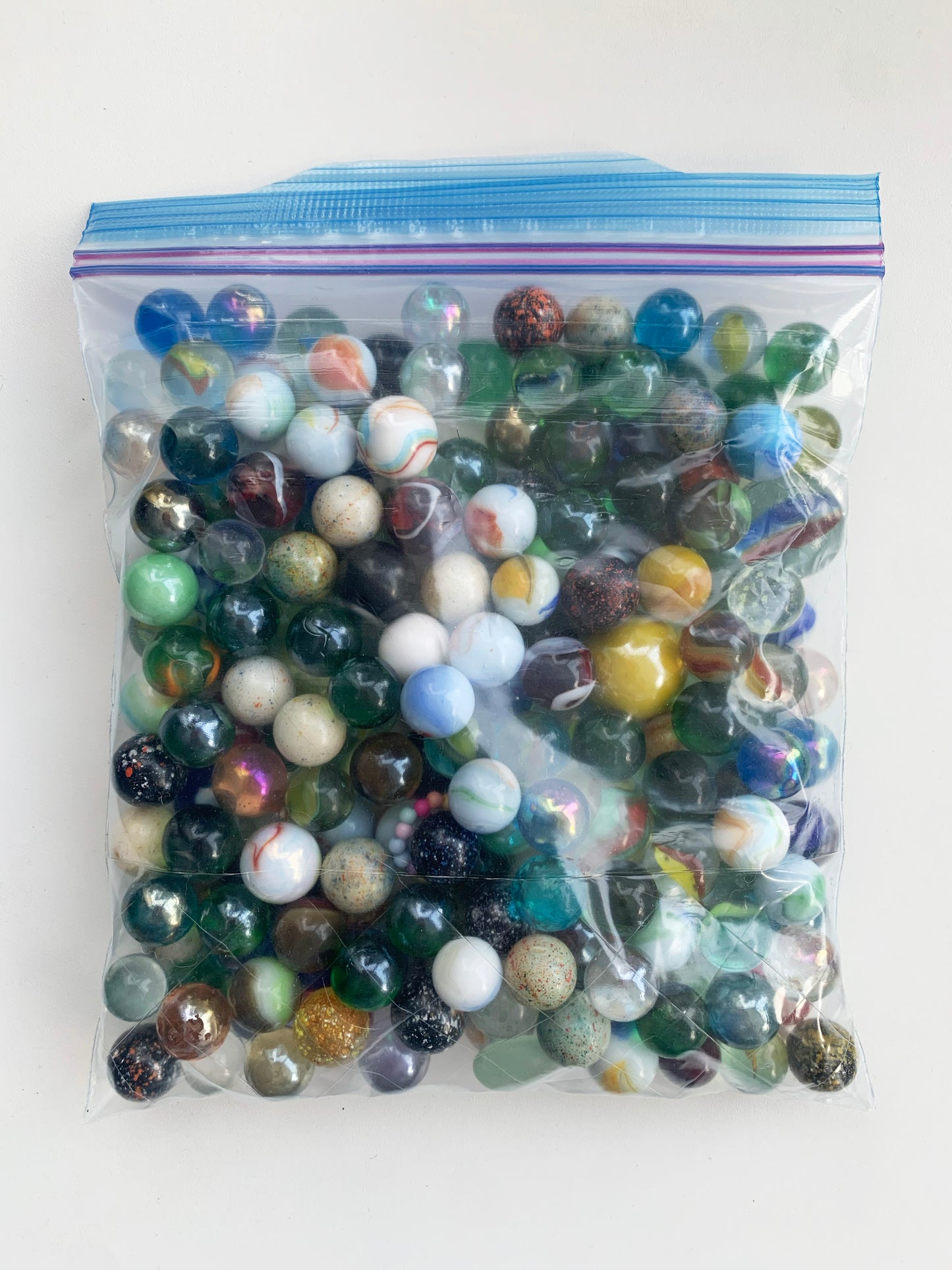 BAG OF MIXED SMALL MARBLES
